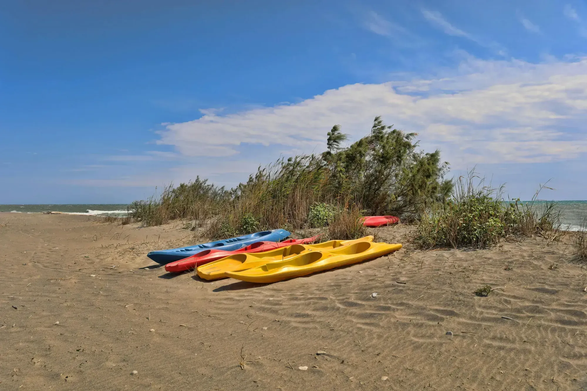 Kayaks on the beach at sunset